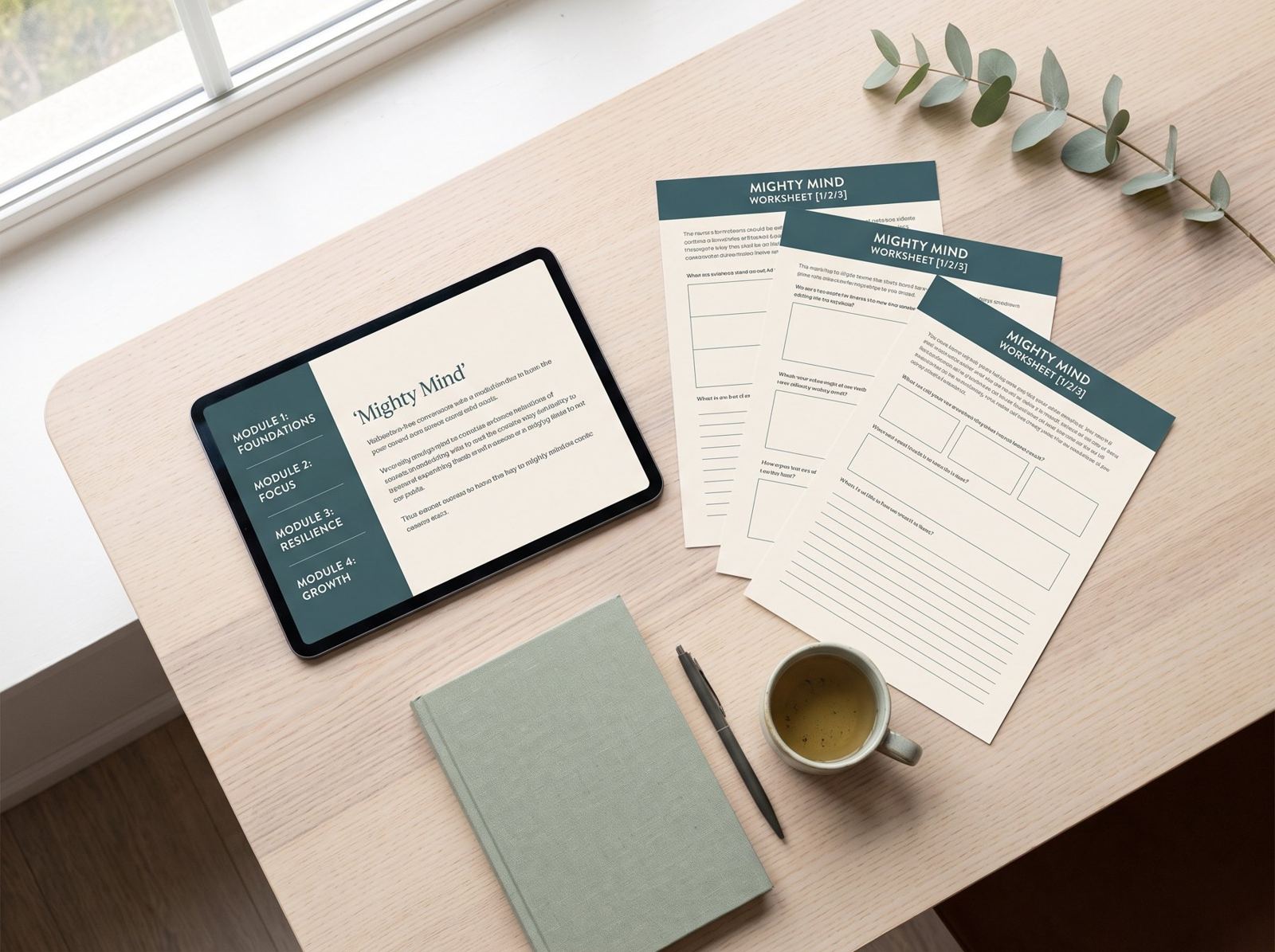A practitioner’s toolkit — the Mighty Mind programme on a tablet beside printed client worksheets